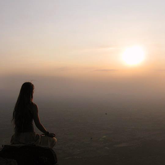 meditation at sundown on a cliff